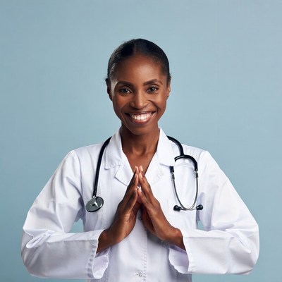 African-American female doctor praying hands
