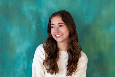 Smiling young woman with brown hair
