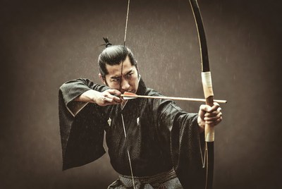 Samurai drawing bow and arrow