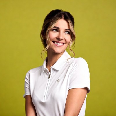 Smiling woman in white polo shirt