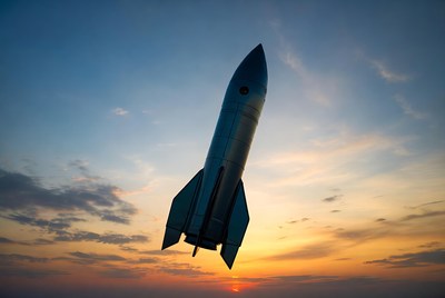 Rocket launching at sunset