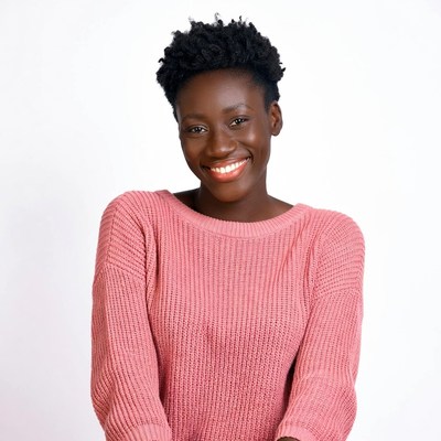Smiling African-American woman in pink sweater