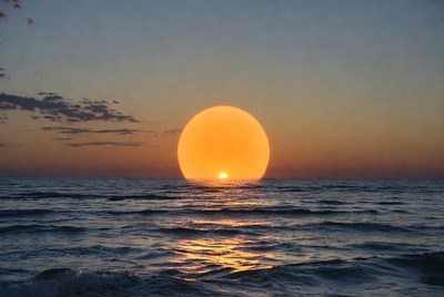 Sunset over ocean waves