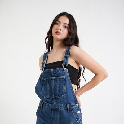 Asian girl in blue overalls