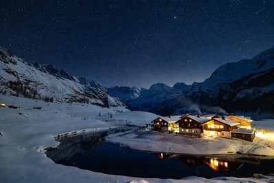 Swiss Chalet Village Under Starry Night Sky