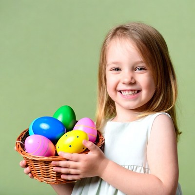 Girl holding Easter basket with eggs