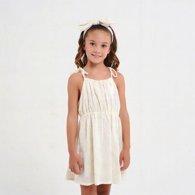 Smiling girl in white sundress