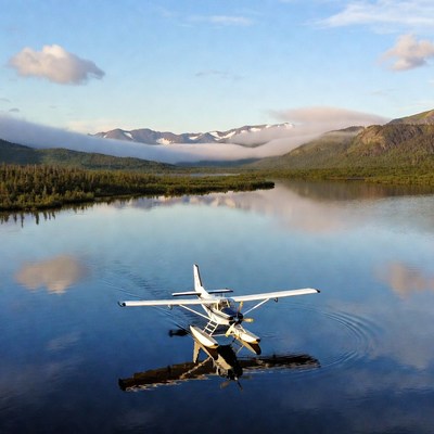 Seaplane on calm mountain lake