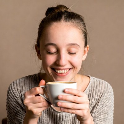 Young woman drinking coffee