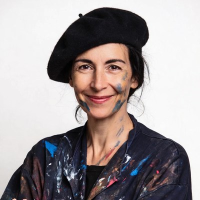 Woman in beret with paint splatters