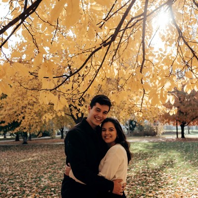 Couple embracing under autumn trees