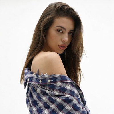 Woman in off-shoulder plaid shirt