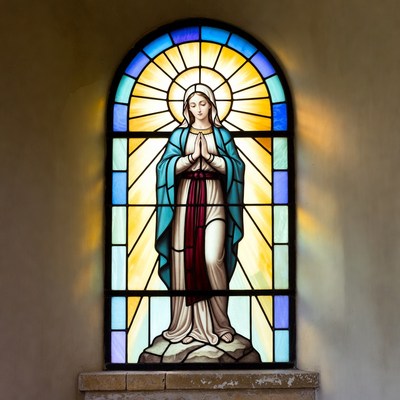 Stained glass Virgin Mary praying