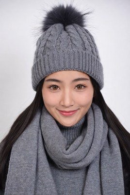 Asian woman in gray beanie and scarf