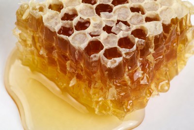 Honeycomb dripping with honey