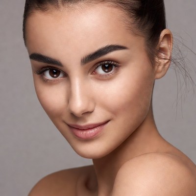 Beautiful woman with dark hair close-up