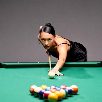 Asian woman playing billiards