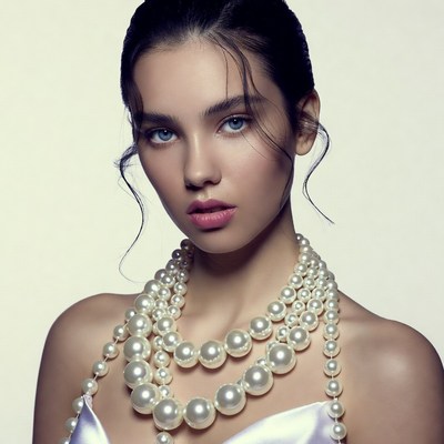 Woman wearing pearl necklace