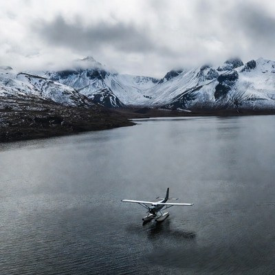 Seaplane on snowy mountain lake