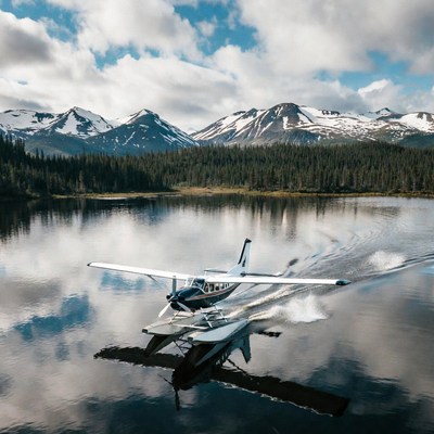 Seaplane Taking Off on Mountain Lake