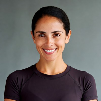 Smiling Latina woman in purple top