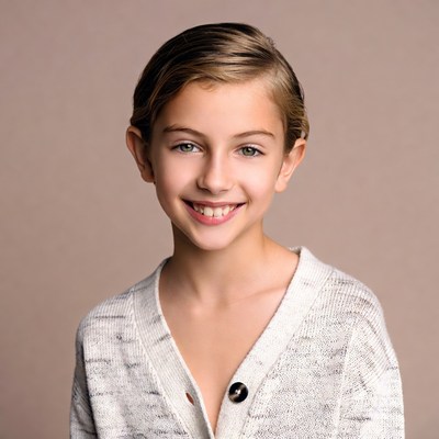 Smiling girl in white cardigan
