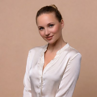 Smiling woman in white silk blouse