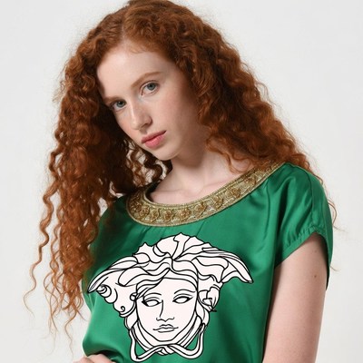 Redhead woman in Versace Medusa shirt