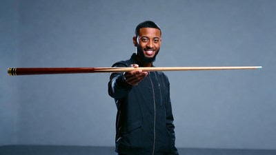African-American man holding pool cue