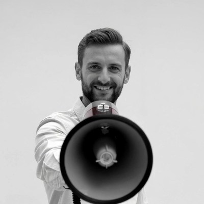 Man holding megaphone smiling