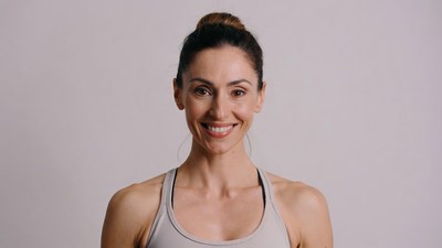 Smiling woman in gray tank top