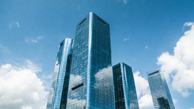 Modern Glass Skyscrapers Against Blue Sky