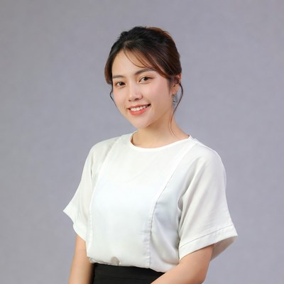Asian woman smiling in white blouse