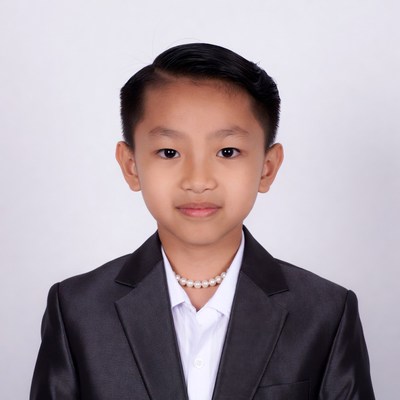 Young Asian boy in suit