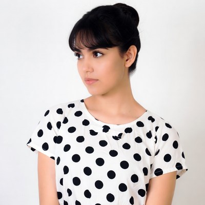 Asian woman in polka dot dress