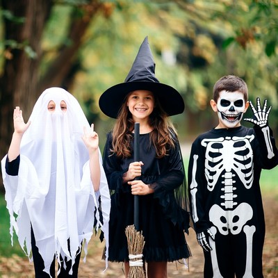 Kids in Ghost Witch Skeleton Costumes