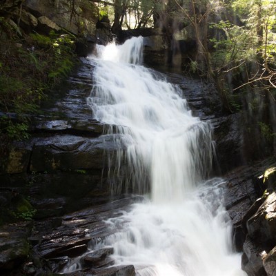 Waterfall cascading over mossy rocks