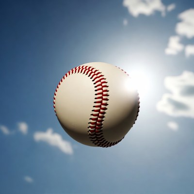 Baseball floating in blue sky