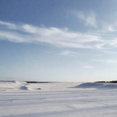 Snowy Landscape Under Blue Sky