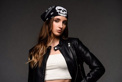 Woman in leather jacket with skull bandana