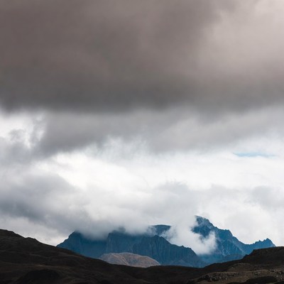 Clouds over rugged mountains