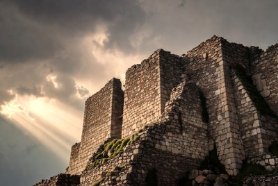 Ancient Stone Castle Ruins with Sun Rays