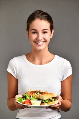 Smiling woman holding veggie burger plate
