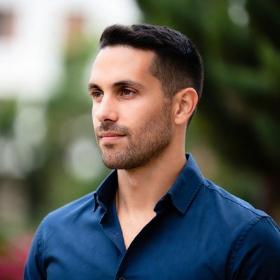 Handsome man in blue shirt outdoors