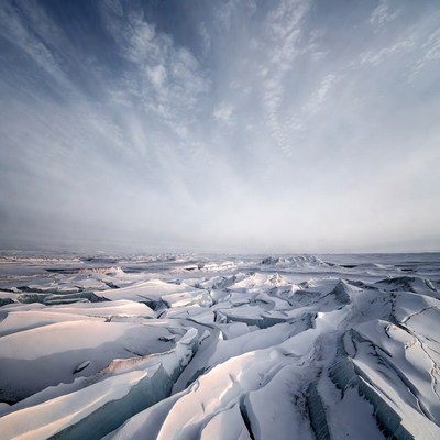 Cracked Ice Field Under Blue Sky