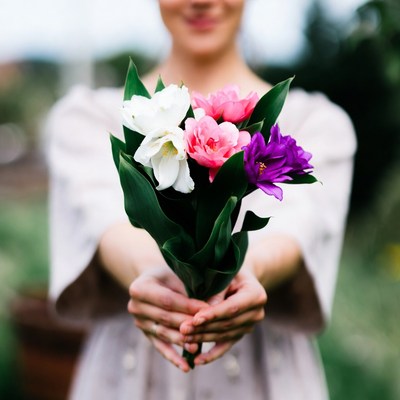 Woman holding colorful bouquet