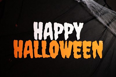 Happy Halloween Text with Spider Webs