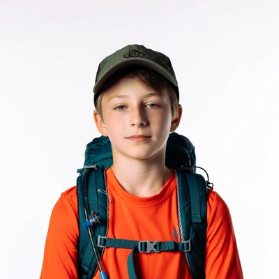 Boy wearing backpack and cap