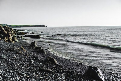 Rocky Black Pebble Beach Seashore