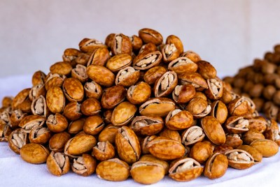 Pile of Roasted Pistachios on White Cloth